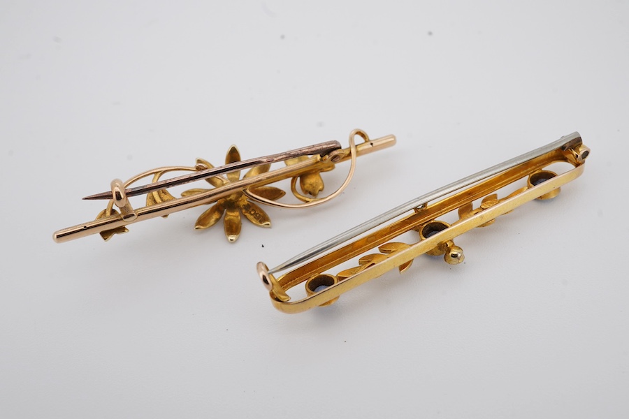 An Edwardian 9ct, sapphire and seed pearl set bar brooch, 43mm, gross weight 2.6 grams, together with a similar 15ct and seed pearl cluster set bar brooch, gross weight 2.9 grams. Condition - fair to good